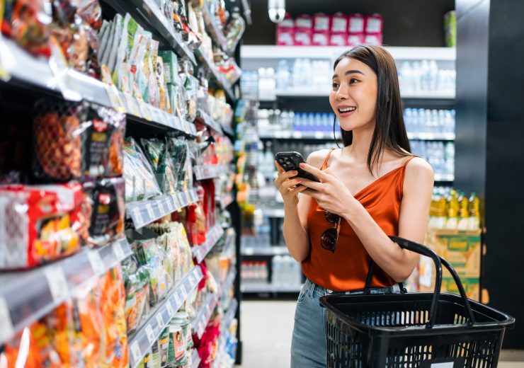 Asian,Young,Beautiful,Woman,Holding,Grocery,Basket,Walk,In,Supermarket.